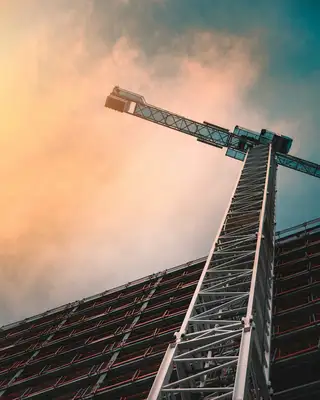 A stock photo of a crane against an orange sky