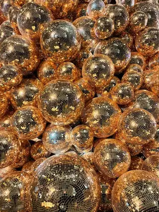A heap of gold mirror balls