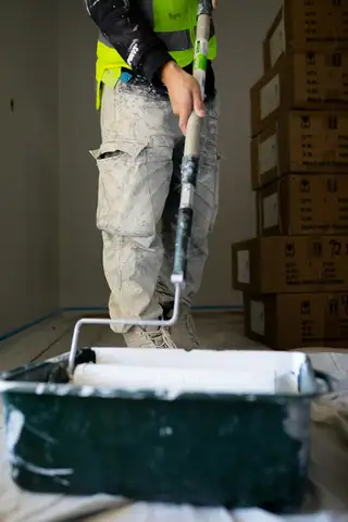 A photo of a painter too dark to make out