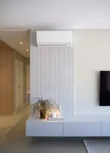 A sleek wall heater in a living room