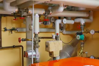 A blurred photo of a pipe repair
