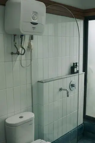 A finished walk-in shower with modern tile